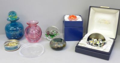 A collection of glass paperweights including Caithness and a Mdina glass scent bottle