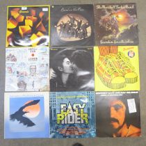 A collection of nine rock LP records including Genesis, Wings, John Lennon