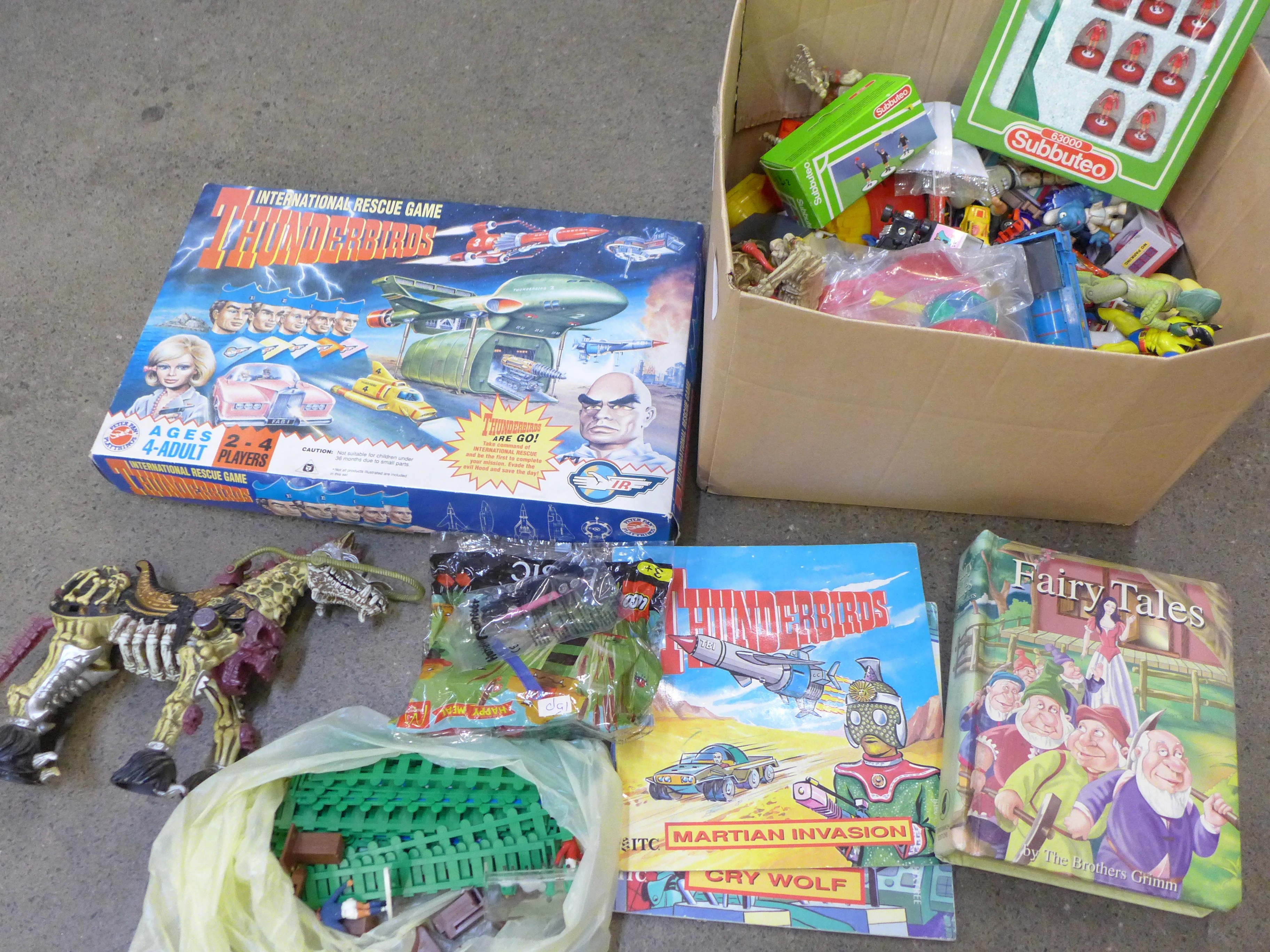 A Thunderbirds International Rescue board game and a box of children's toys, Subbuteo, die-cast