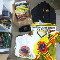 A collection of Nottingham Panthers ice hockey items including a shirt, hat, scarf, T-shirt, jacket,