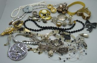 A collection of costume jewellery including a faceted bead necklace and a large Sarah Coventry
