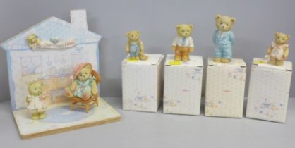 A Cherished Teddies house display stand and three bears, boxed