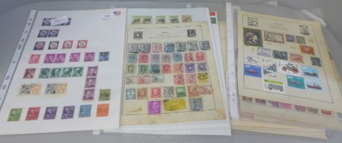 A collection of postage stamps and a page of Tonga Air Mail stamps