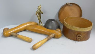 A horseshoe pin cushion, two wooden shoe lasts, a leather collar box and a brass model of Krishna