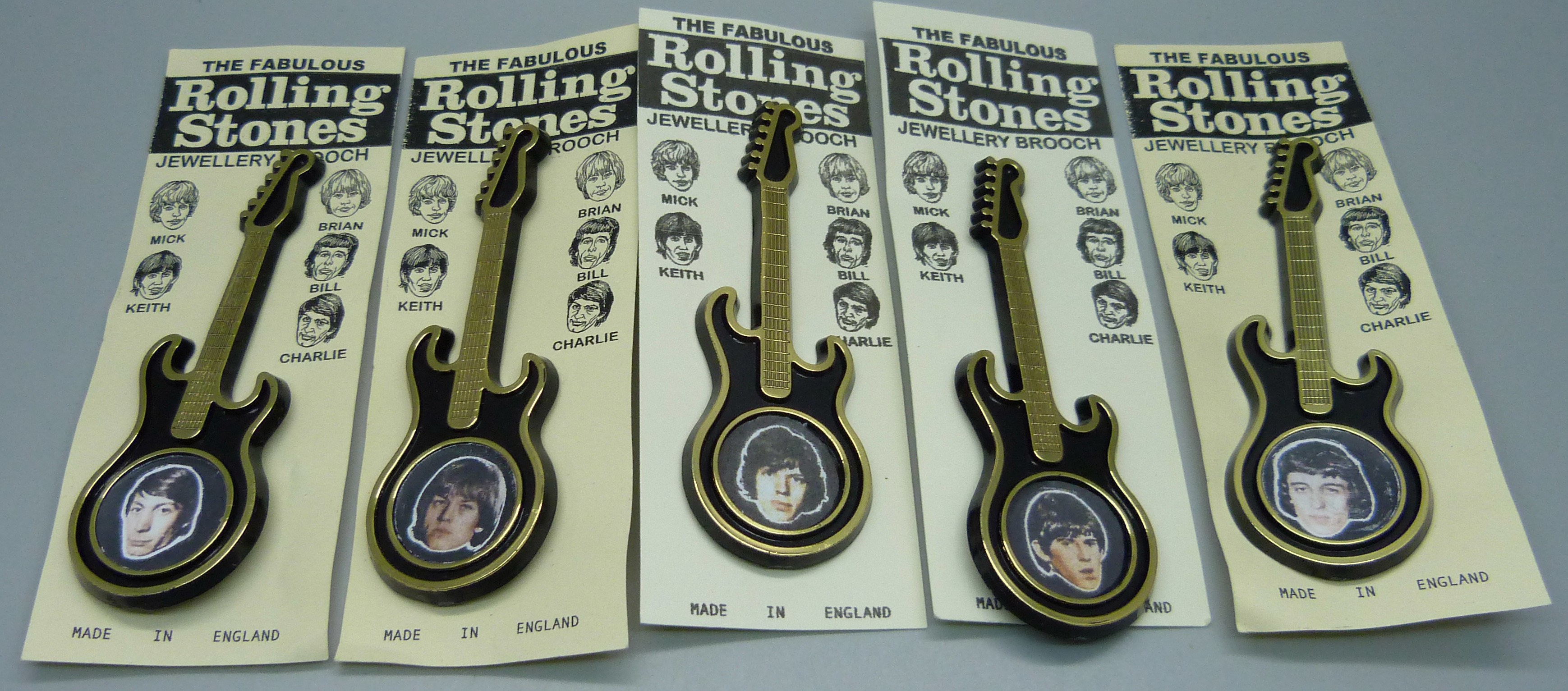 Five Rolling Stones guitar brooches