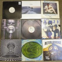 A collection of LP records and 12" singles including Jean-Michel Jarre, A-Ha and Queen (25)