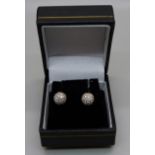 A pair of pave set diamond ear studs, marked 850, test as 18ct gold, 3.5g
