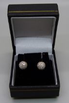 A pair of pave set diamond ear studs, marked 850, test as 18ct gold, 3.5g