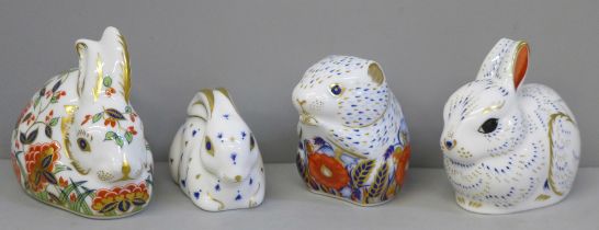 Three Royal Crown Derby rabbit paperweights, all with gold stoppers, and a Poppy Mouse, gold stopper