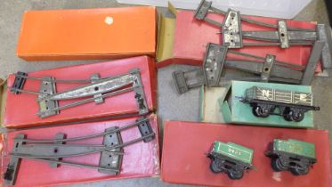 Five boxes of O gauge Hornby track and three Hornby O gauge wagons