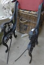 A pair of cast iron bench ends