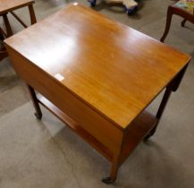 A teak drop leaf cocktail trolley