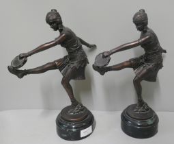 Two resin figures of dancing ladies on plinths