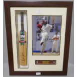 A framed cricket display, photograph and miniature cricket bat, both signed by Brian Lara, West