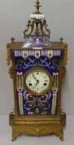 An enamel fronted gilt cased mantel clock