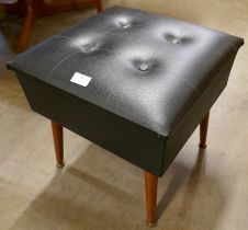 A teak and black vinyl lady's sewing box