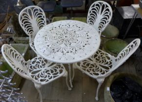 A metal garden table and four chairs