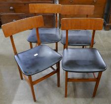A set of teak dining chairs