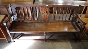 An early 20th Century oak and elm bench