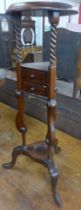 A Victorian style mahogany wig stand