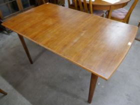 A teak rectangular dining table