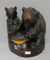 A Japanese carved softwood figure of bears