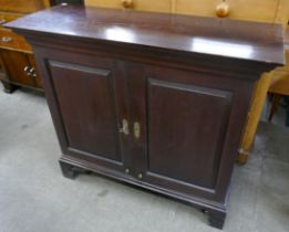 A George II mahogany two door fitted cupboard