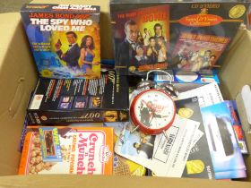 A James Bond Collection including clock, flyers, games, cereal packets, VHS/CD sets, etc.