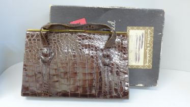 A crocodile skin handbag in a Griffin & Spalding box