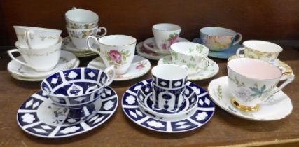 A collection of tea cups and saucers including Royal Crown Derby Unfinished pattern, Royal Worcester