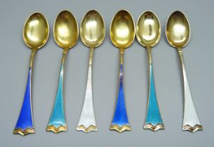 A set of six silver gilt and enamel coffee spoons, stamped 925S, enamel a/f on one white and one