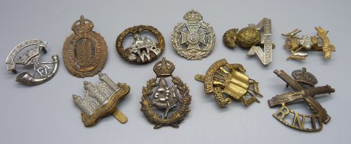 Ten military regimental cap badges, including 9th and 12th Lancers, Queen's Own Worcestershire