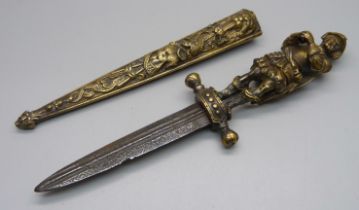 A European brass dagger and scabbard with figural handle, overall length 26cm