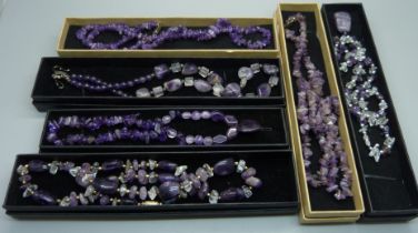 Six amethyst necklaces, boxed
