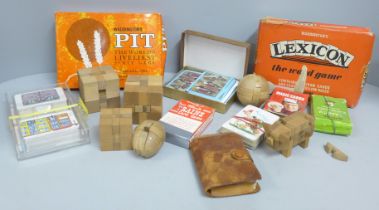 A collection playing cards, card games and wooden puzzles