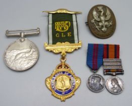 A 14th King's Hussars badge, an Africa Service Medal to 211637 J. Wright, two miniature medals and a