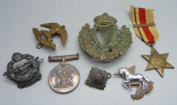 A Regiment President Kruger military badge, a large Irish regimental badge, a South Africa For War