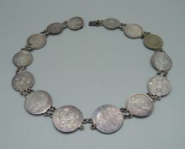 A collar/necklet, made from fourteen 18th and 19th Century coins, including Queen Anne, George II,