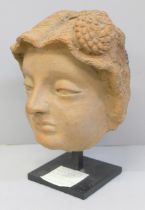 A Kashmir terracotta head of a Saint, possibly 6th Century, incised hair detail on a black painted