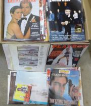A collection of James Bond magazines, poster, James Bond related Playboy issues, etc.