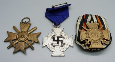 A Third Reich 25 Years Civilian Service medal, Hindenburg Cross 1914-1918 and a 1939 Merit Cross