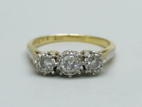 An 18ct gold and three stone diamond ring, 3.1g, N, centre stone approximately 0.25 carat