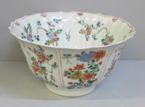 A Chinese famille verte bowl, hand painted with birds and flowers, Kangxi period, restored