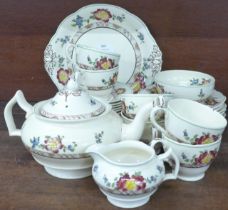 A Crescent ware tea set, six setting, with teapot, cream and sugar and bread and butter plate