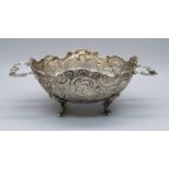 An embossed two handle German 800 silver dish, 108g