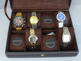 Five wristwatches including Timex, in a watch display box