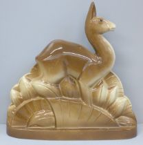 A French Art Deco ceramic doe, signed to reverse