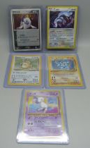 Five holographic vintage Pokemon cards, English and Japanese pocket monsters and German 1st
