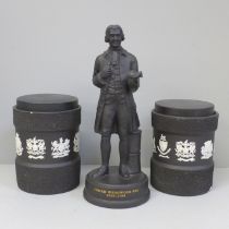 A Wedgwood Josiah Wedgwood figure and a pair of Wedgwood black basalt tobacco jars with match