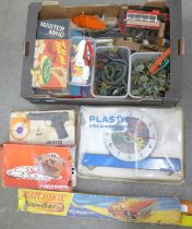 A box of toys, games, models from 1960s onwards including plastic soldiers, rubber animals and